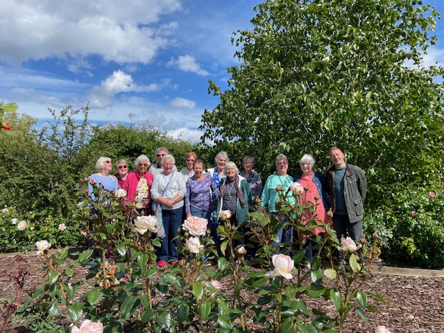 Group photo of Angmering Horticultural Club members in rose garden.